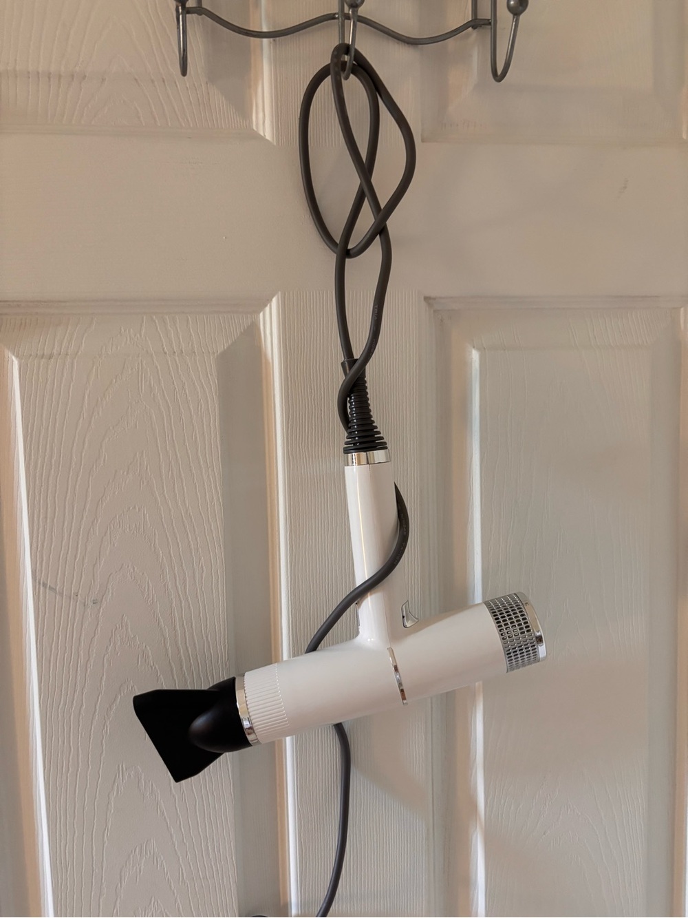 White Handheld Hair Dryer with Black Nozzle